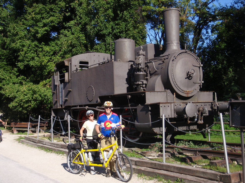 Dennis and Terry Struck are next to an Austrian Locomotive.